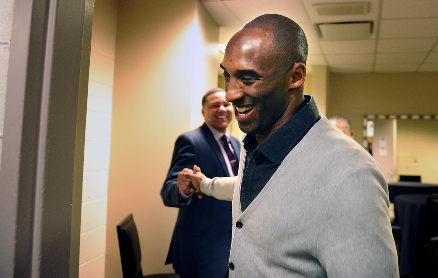 Kobe Bryant greets friends before the Lakers' game against the Pelicans in New Orleans.