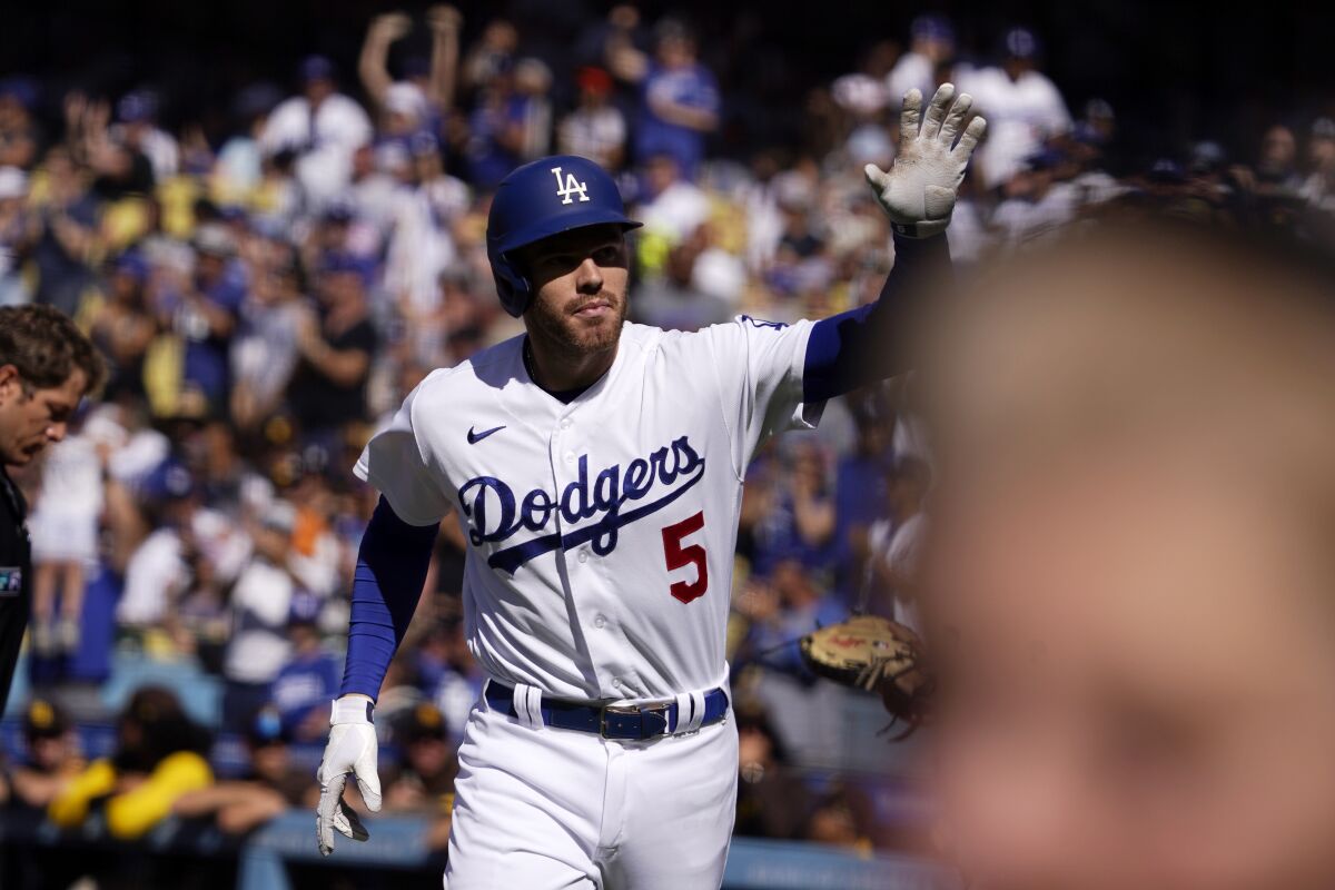 Freddie Freeman waves to fans at Dodger Stadium after homering in the first inning July 2, 2022.