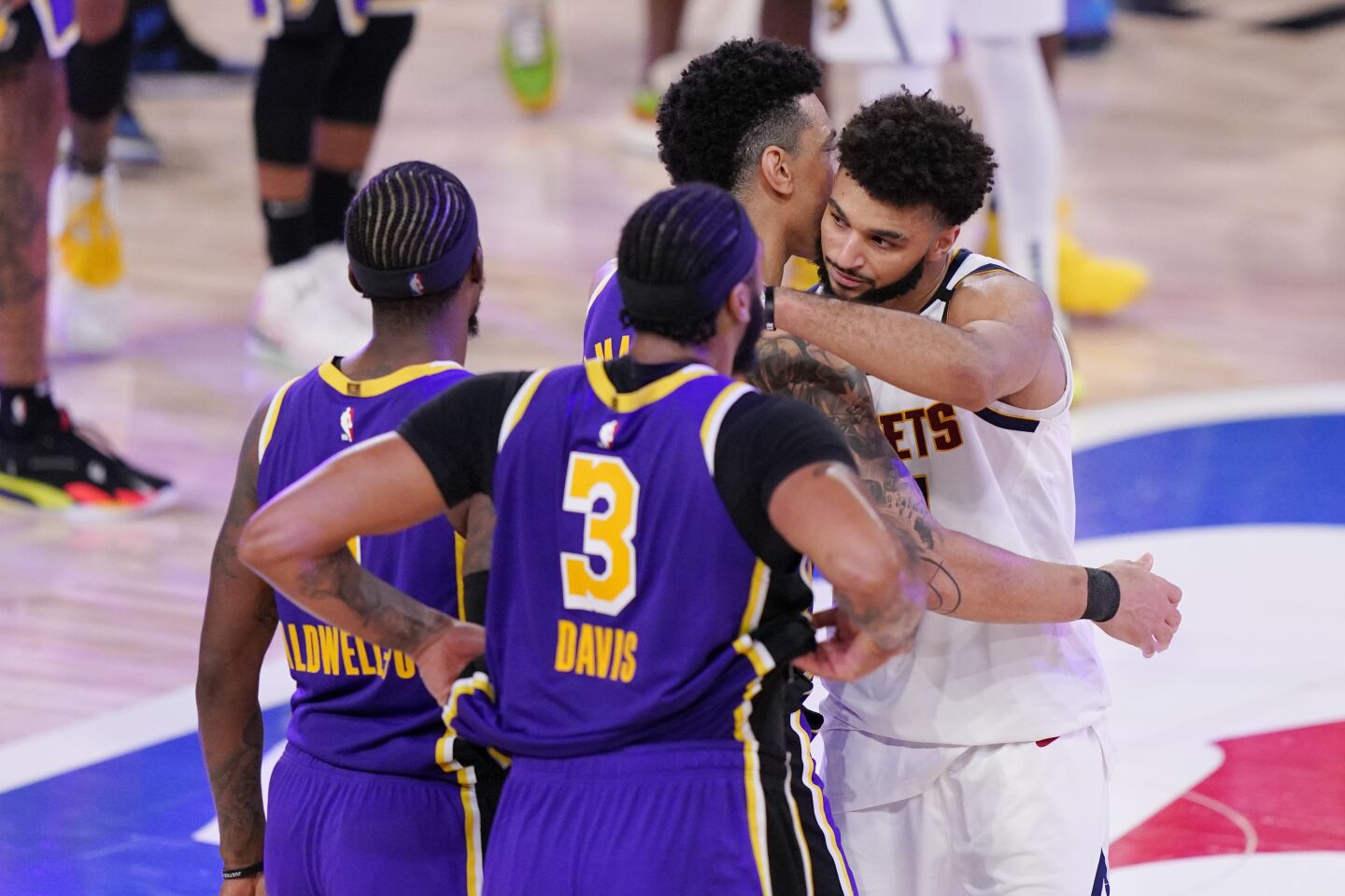 Nuggets guard Jamal Murray, right, congratulates Lakers after Game 5.