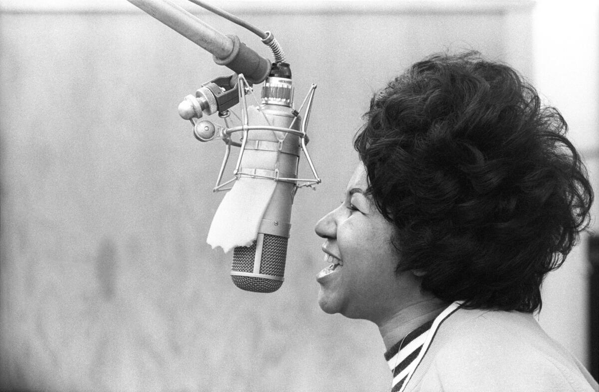 Aretha Franklin sings in the Atlantic Records studio during "The Weight" recording session on Jan. 9, 1969, in New York City.