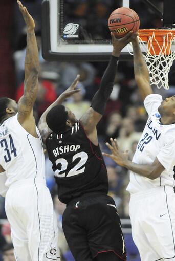 UConn's Alex Oriakhi and Roscoe Smith play defense in the first half