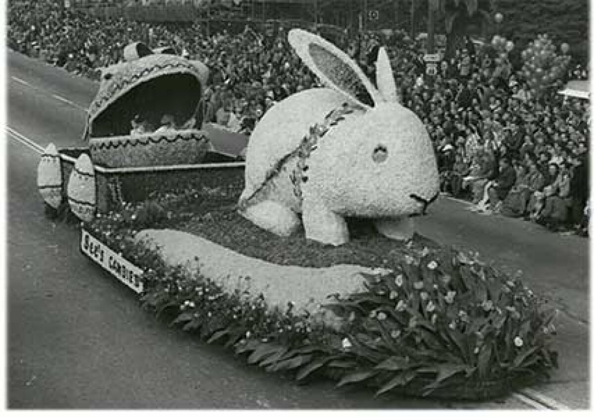 A black and white photograph of a float with a large white bunny on it
