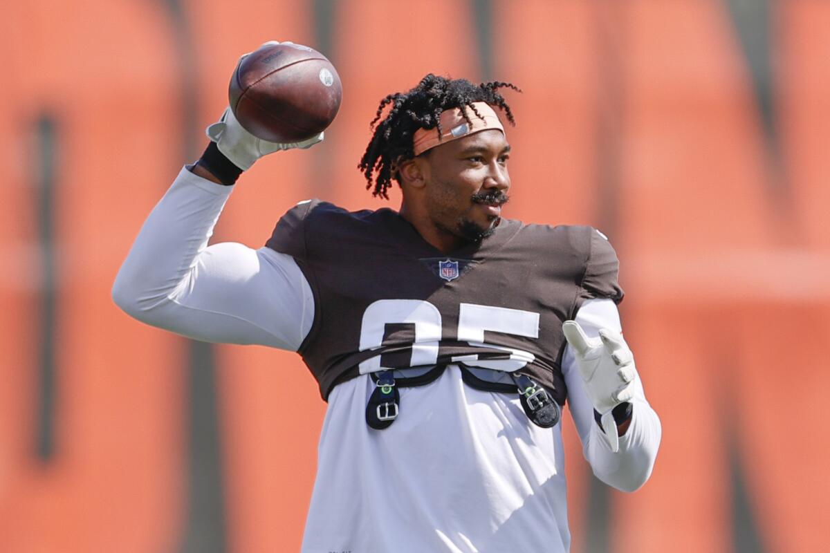 Cleveland Browns defensive end Myles Garrett throws the ball during NFL football practice Wednesday, Sept. 1, 2021, in Berea, Ohio. (AP Photo/Ron Schwane)