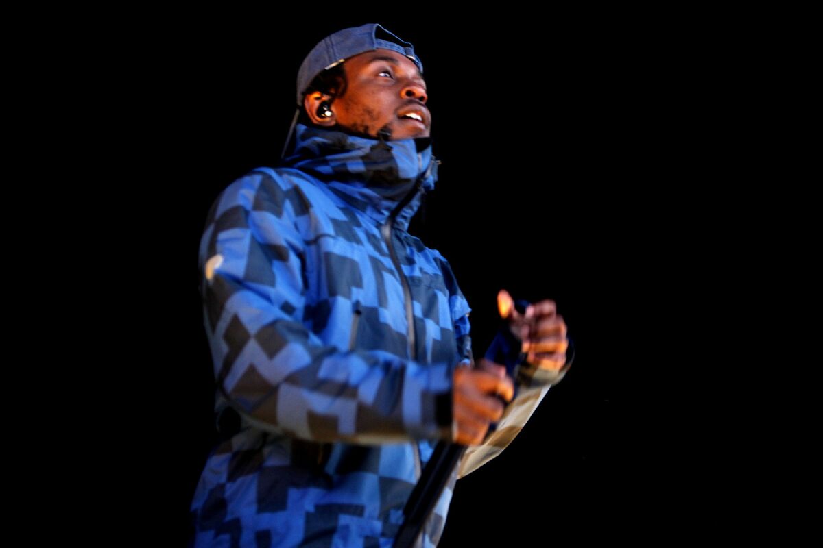 Kendrick Lamar performs at the Air + Style concert and snowboarding event at the Rose Bowl in Pasadena on Saturday.