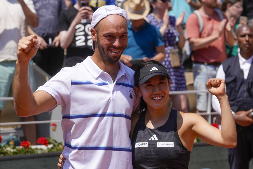 Japan's Miyu Kato, right, and Germany's Tim Puetz celebrate winning the mixed doubles final match of the French Open tennis tournament against Canada's Bianca Andreescu and New Zealand's Michael Venus in two sets, 4-6, 6-4, 1-0 (10-6), at the Roland Garros stadium in Paris, Thursday, June 8, 2023. (AP Photo/Thibault Camus)