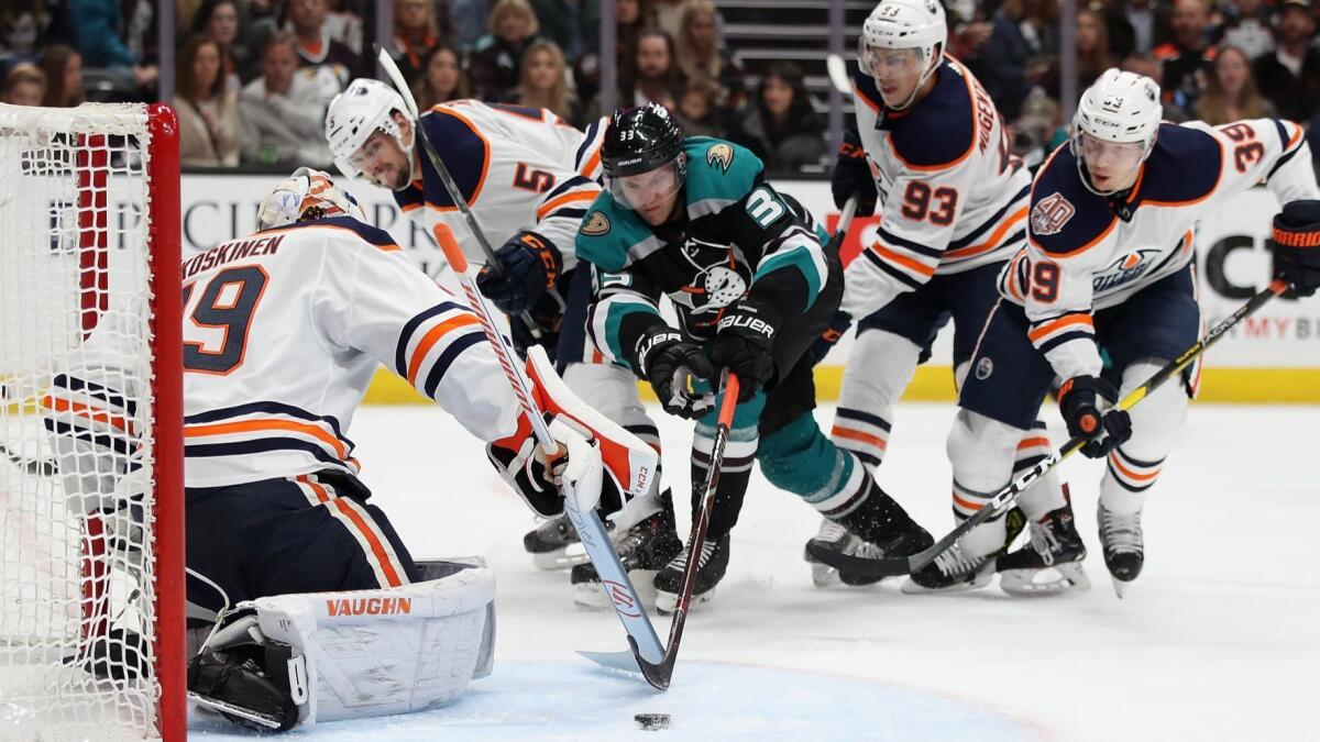 Ducks winger Jakob Silfverberg can't quite reach the puck as Oilers goalie Mikko Koskinen defends in the crease during a game Nov. 23 in Anaheim.