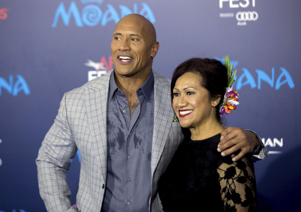 FILE - Dwayne Johnson, left, and his mother Ata Johnson appear at the 2016 AFI Fest - "Moana" premiere in Los Angeles on Nov. 14, 2016. Johnson credits the women in his life including his ex-wife and business partner Dany Garcia, his wife Lauren, mother Ata, and three daughters for making him who he is. (Photo by Willy Sanjuan/Invision/AP, File)