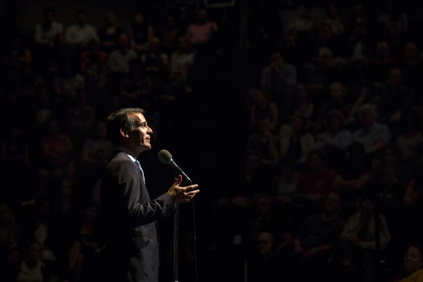 LOS ANGELES, --MAY 04, 2017-- Los Angeles Mayor Eric Garcetti speaks during The Moth StorySLAM, where the theme was "Home," at the Los Angeles Theatre Center, in downtown Los Angeles, CA, May 04, 2017. (Jay L. Clendenin / Los Angeles Times)