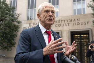 Former Trump White House official Peter Navarro talks to the media as he arrives at U.S. Federal Courthouse in Washington, Thursday, Jan. 25, 2024. (AP Photo/Jose Luis Magana)