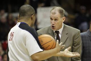Cleveland Cavaliers assistant coach Chris Jent argues with referee Tony Brothers.