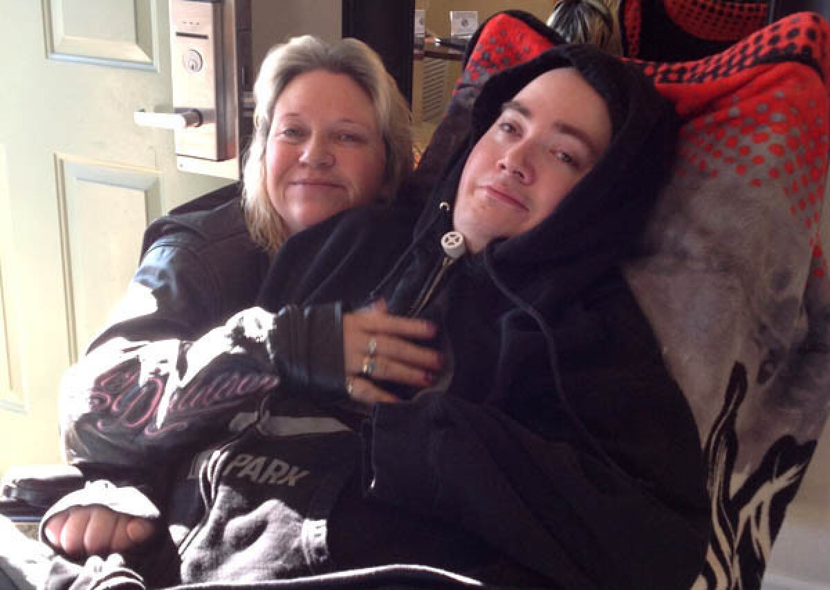 Brandon Maxfield with his mother, Sue Stansberry, in 2013.
