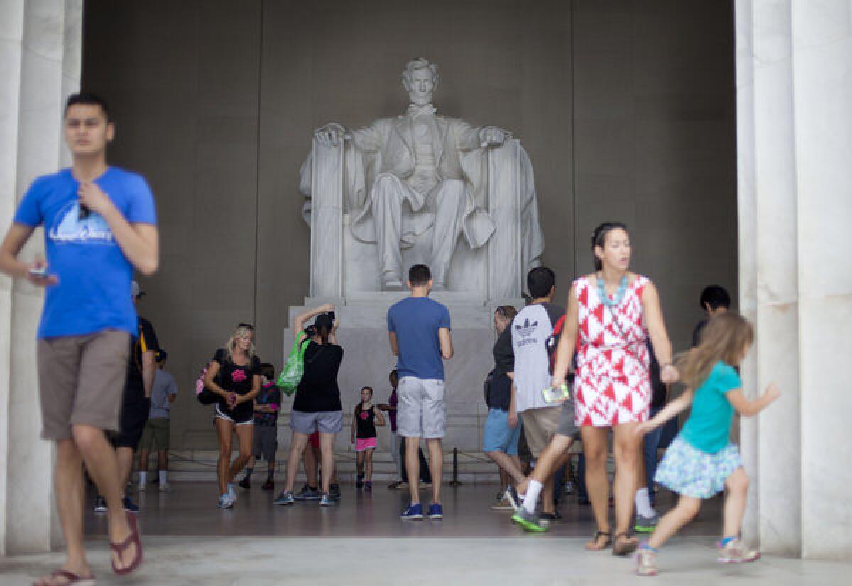 Tourist and visitors are seen at the Lincoln Memorial on the National Mall in Washington, D.C.