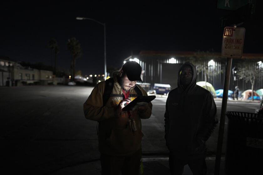 San Diego, CA - January 26: Working in the East Village, Miguel Figueroa was among the volunteers working on Thursday, Jan. 26, 2023 before sunrise in San Diego, CA., for the annual point-in-time count taking place in San Diego County. Nelvin C. Cepeda / The San Diego Union-Tribune)