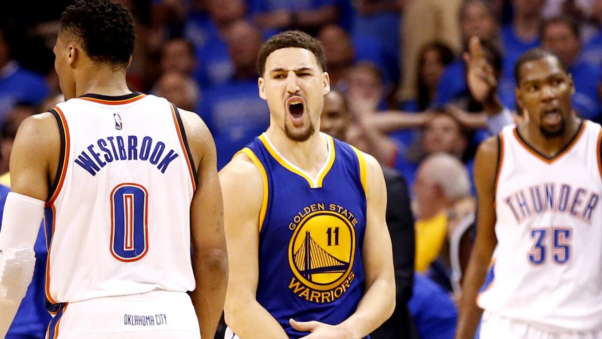 While Warriors guard Klay Thompson (11) was making 11 of 18 three-pointers, Thunder stars Russell Westbrook and Kevin Durant (35) watched their NBA Finals hopes slip away in Game 6.