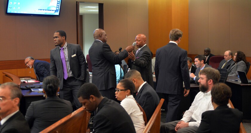 Defendants and their attorneys in court in Atlanta on Monday.