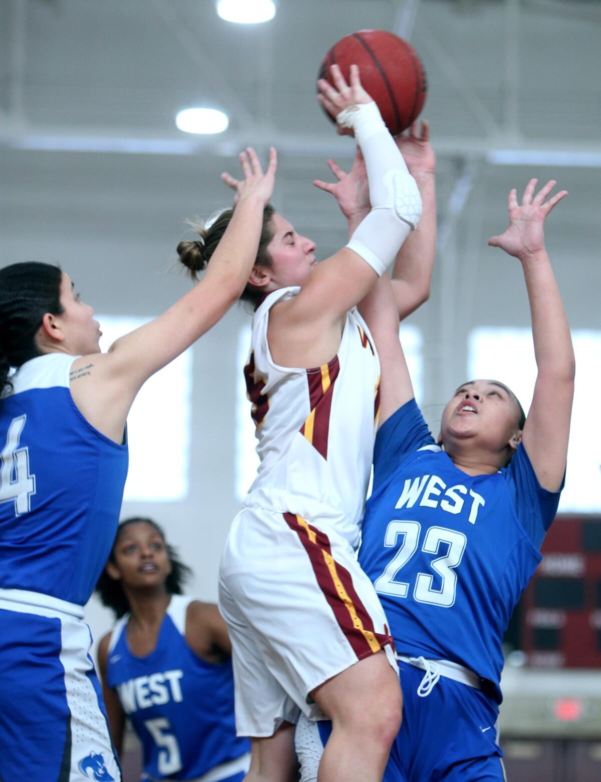 Glendale Community College basketball player Gloria Bianchi shoots under pressure in game vs. West Los Angeles College, at home in Glendale on Saturday, Feb. 1, 2020. GCC won it's 21st consecutive game 78-55.