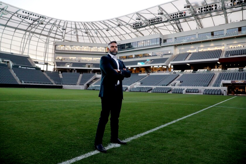  Ramit Varma stands in the middle of an empty stadium field