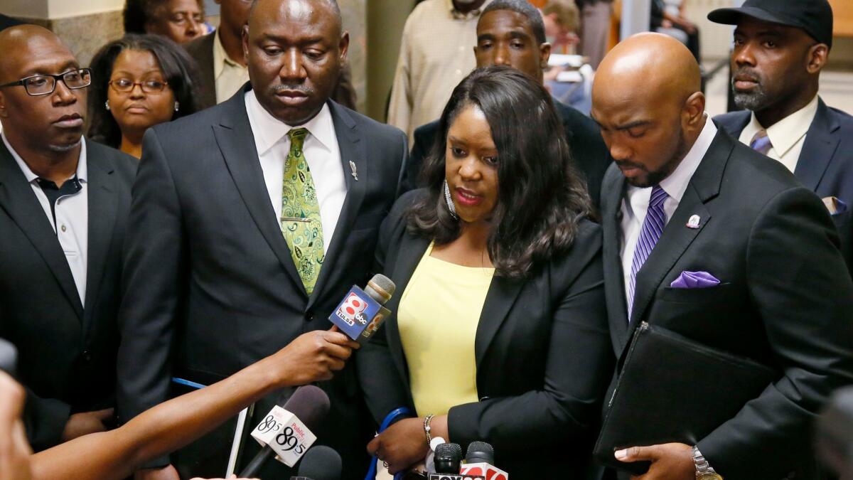 Tiffany Crutcher, twin sister of Terence Crutcher, talks with the media as she leaves the courtroom in the trial of Officer Betty Jo Shelby in Tulsa, Okla.