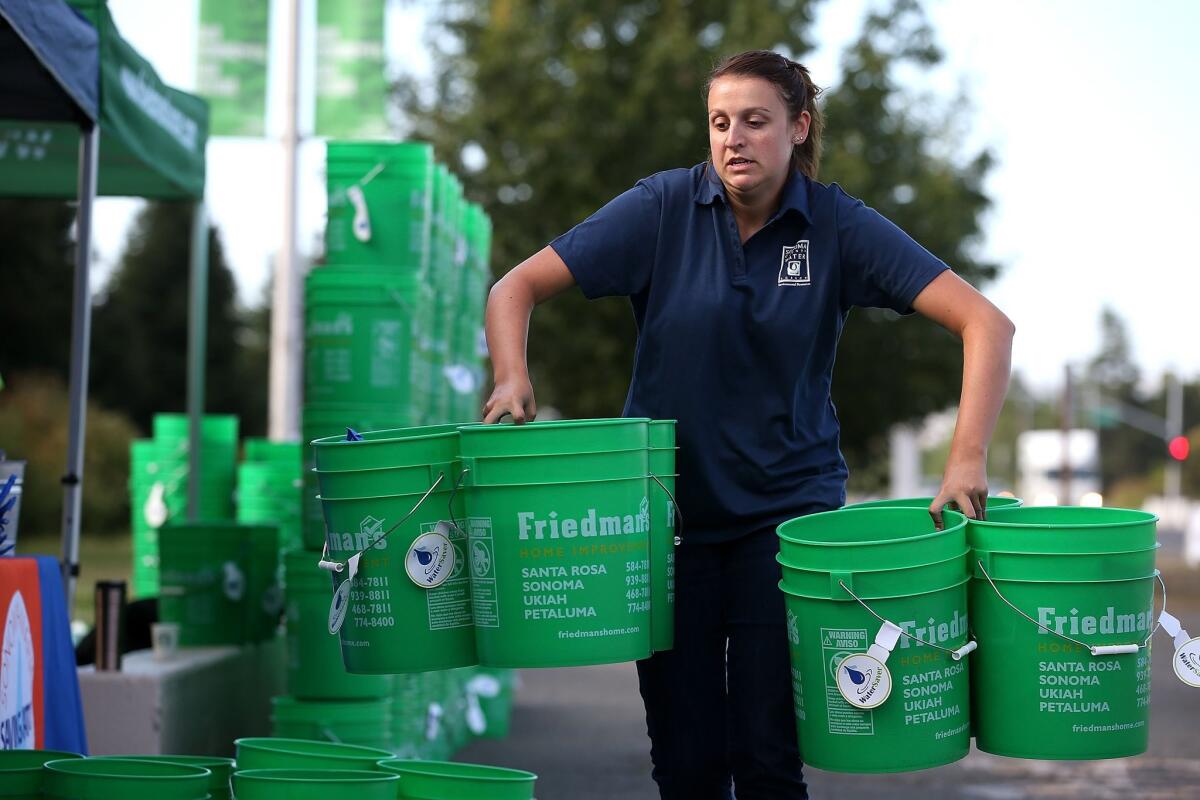The Sonoma County Water Agency hands out buckets filled with water conservation tools and literature as the state copes with its fourth year of drought.