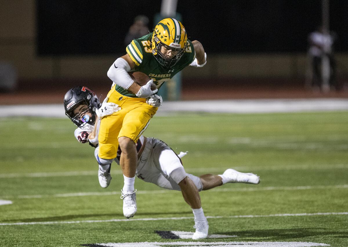 Edison's Nico Brown is wrapped up by San Clemente's Ethan Rea on Friday.