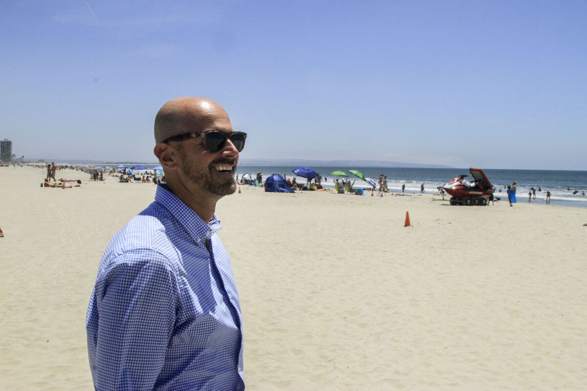 Mayor Richard Bailey walks along his city's shoreline.