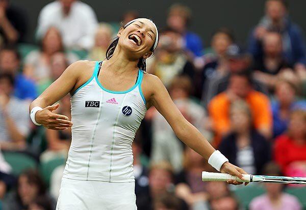 Kimiko Date-Krumm of Japan reacts as she plays Venus Williams of the U.S. during their second-round match for the Wimbledon Championships at the All England Lawn Tennis Club in London. Date-Krumm, 40 years old and only 5-foot-5, last played on Wimbledon's Centre Court 15 years ago in a semifinal match against Steffi Graf.
