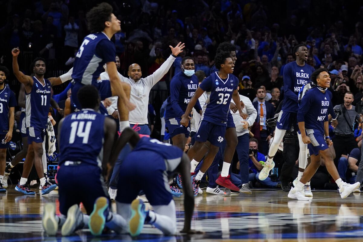 Saint Peter's celebrates after winning a college basketball game against Purdue in the Sweet 16 round of the NCAA tournament, Friday, March 25, 2022, in Philadelphia. (AP Photo/Matt Rourke)
