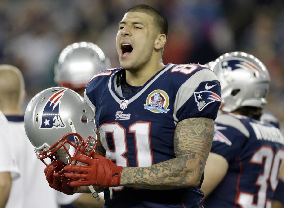 New England tight end Aaron Hernandez reportedly was at a bar with Odin Lloyd on the night Lloyd was slain, although Hernandez has not been named as a suspect.