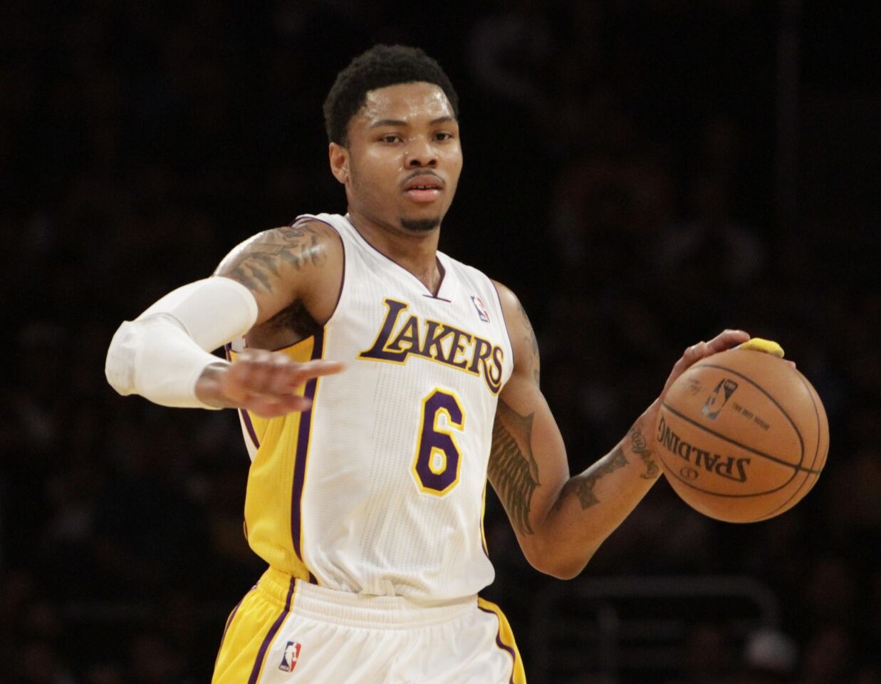 Lakers guard Kent Bazemore dribbles during the Lakers' 115-99 win over the Phoenix Suns on Sunday.