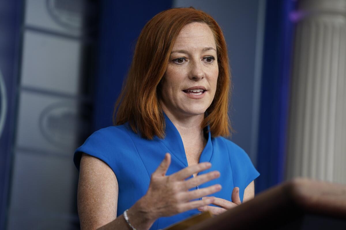 White House Press Secretary Jen Psaki speaks at a lectern.