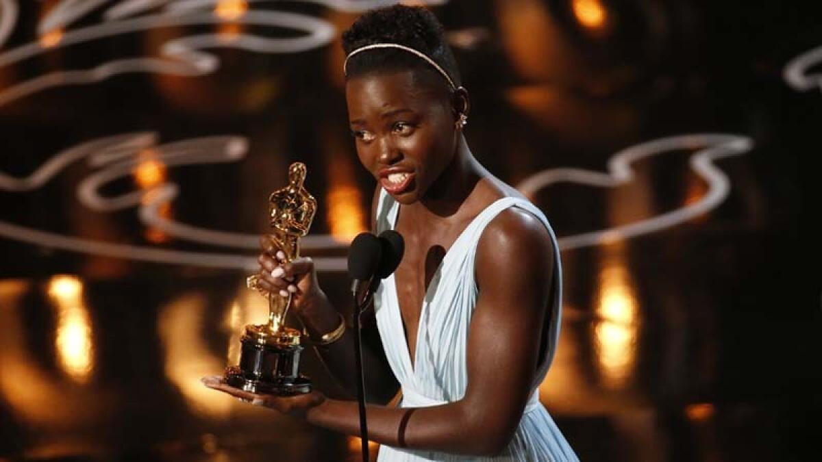 Lupita N'yongo accepts the supporting actress Academy Award for her work in "12 Years a Slave" on March 2, 2014.