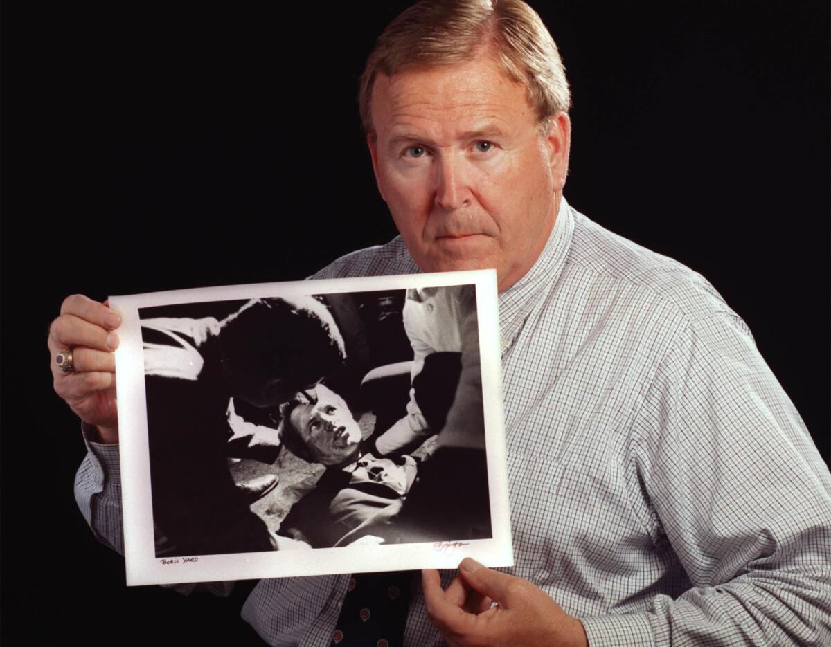 June 5, 1998: Los Angeles Times photographer Boris Yaro with one of the photos he took the night Sen. Robert F. Kennedy was shot at the Ambassador Hotel in Los Angeles.