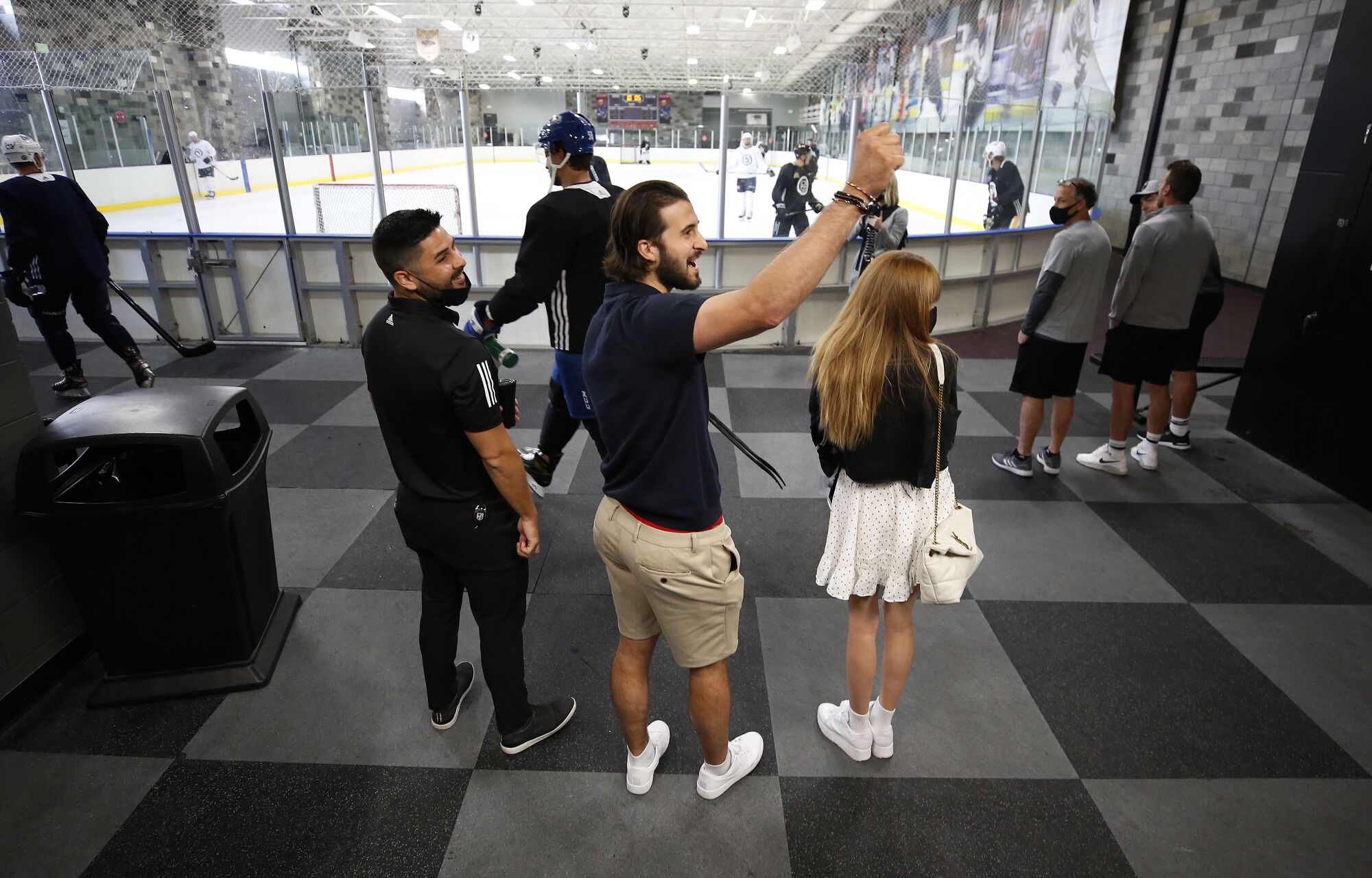 New Los Angeles Kings player Phillip Danault, his wife, Marie, waves to a former teammate.