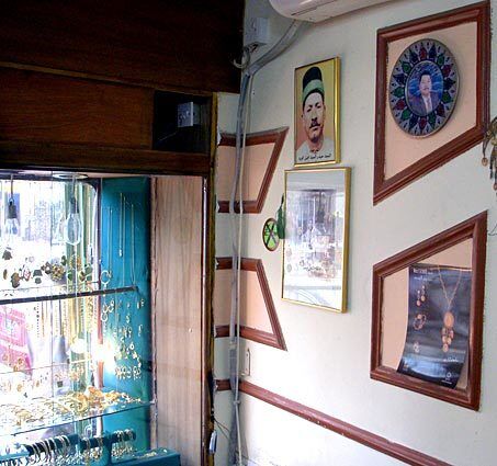 Photographs of Adnan Walid's famed goldsmith father adorn his shop in Baghdad's Kadhimiya district, home to a key Shiite shrine. The jewelry sold in the Kadhimiya district is especially prized by Iraqi and Iranian Shiites, who consider it a blessing from the imams buried there. Before U.S.-led forces invaded in 2003, the shopkeepers say, as many as 3,000 Iranians visited every day, but now most pilgrims head to shrines in the relatively peaceful south.