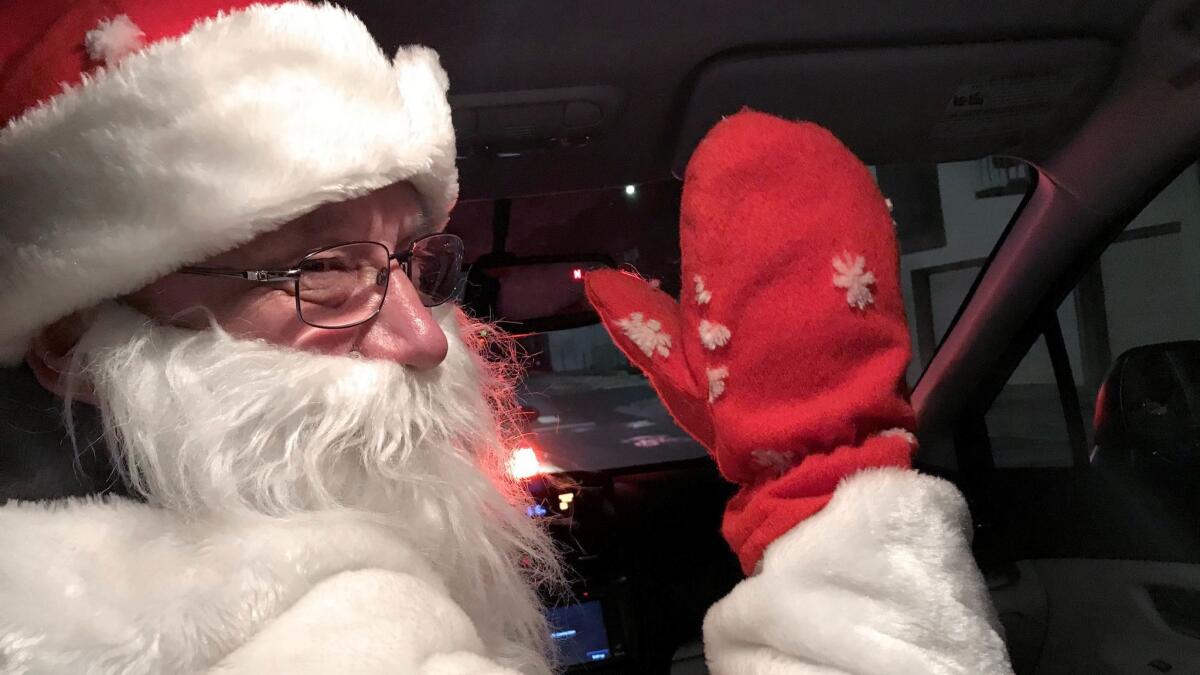 A Lyft driver in San Francisco delivers some yule time cheer from the driver's seat.