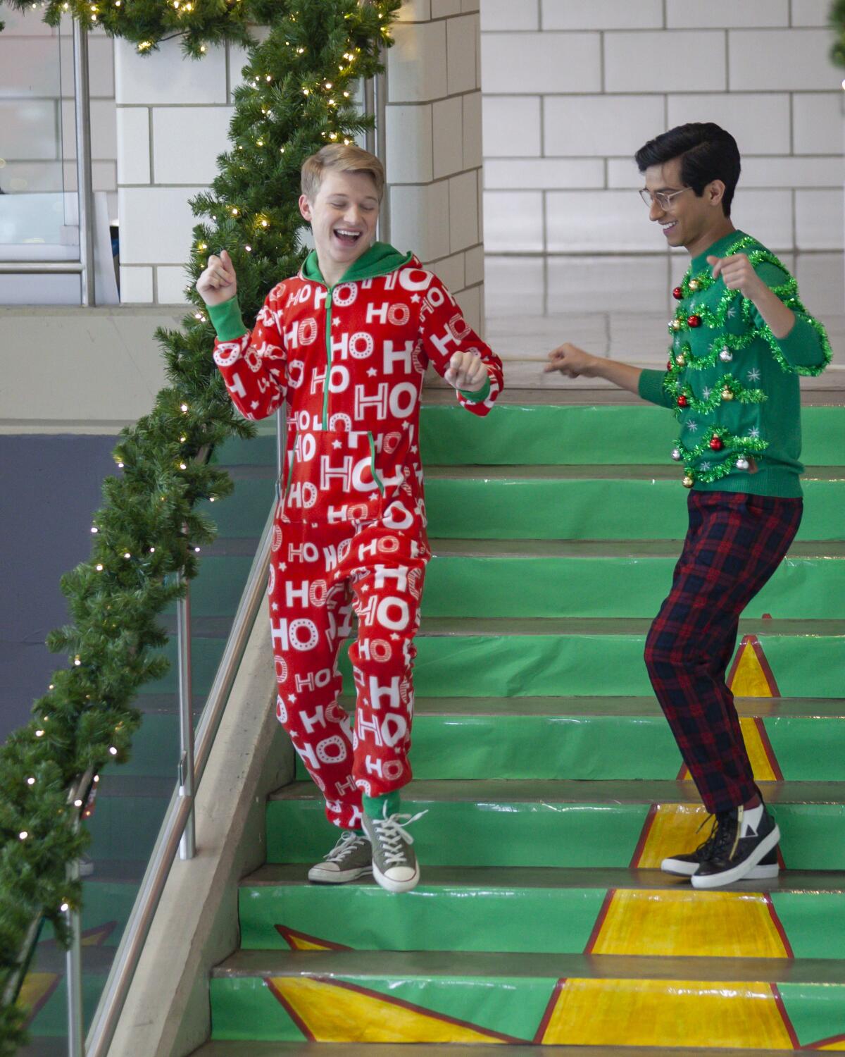 Joe Serafini and Frankie A. Rodriguez performing in holiday attire for "High School Musical: The Series"