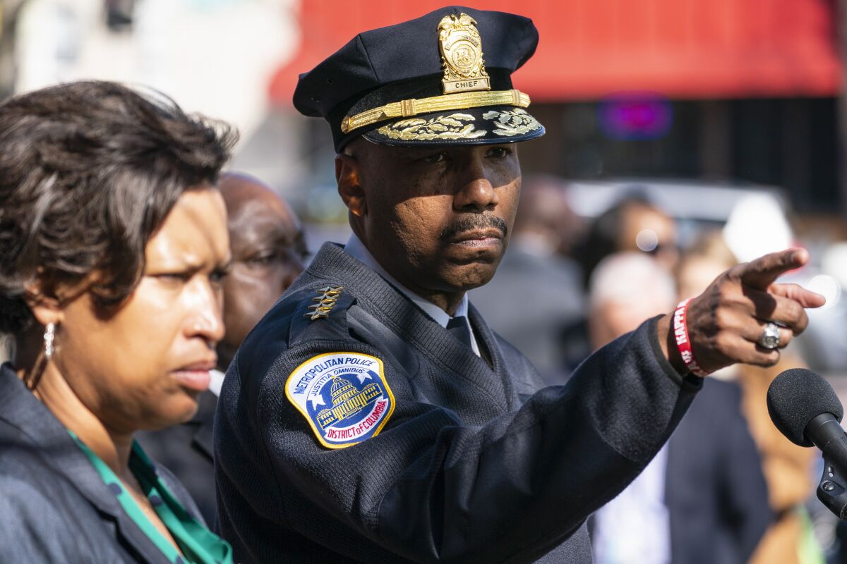 Washington Mayor Muriel Bowser, left, and Washington Metropolitan Police Chief Robert Contee III, speak during a news conference about the arrest of suspect in a recent string of attacks on homeless people, Tuesday, March 15, 2022, in Washington. A gunman suspected of stalking homeless people asleep on the streets of New York City and Washington, killing at least two people and wounding three others, was arrested early Tuesday, police said. (AP Photo/Alex Brandon)