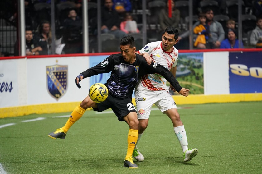 On Sunday night, Dec. 29, the Sockers wore uniforms with Darth Vader on the front on "Star Wars Night." Here, San Diego's Cesar Cerda (left) battles a Sonora player.