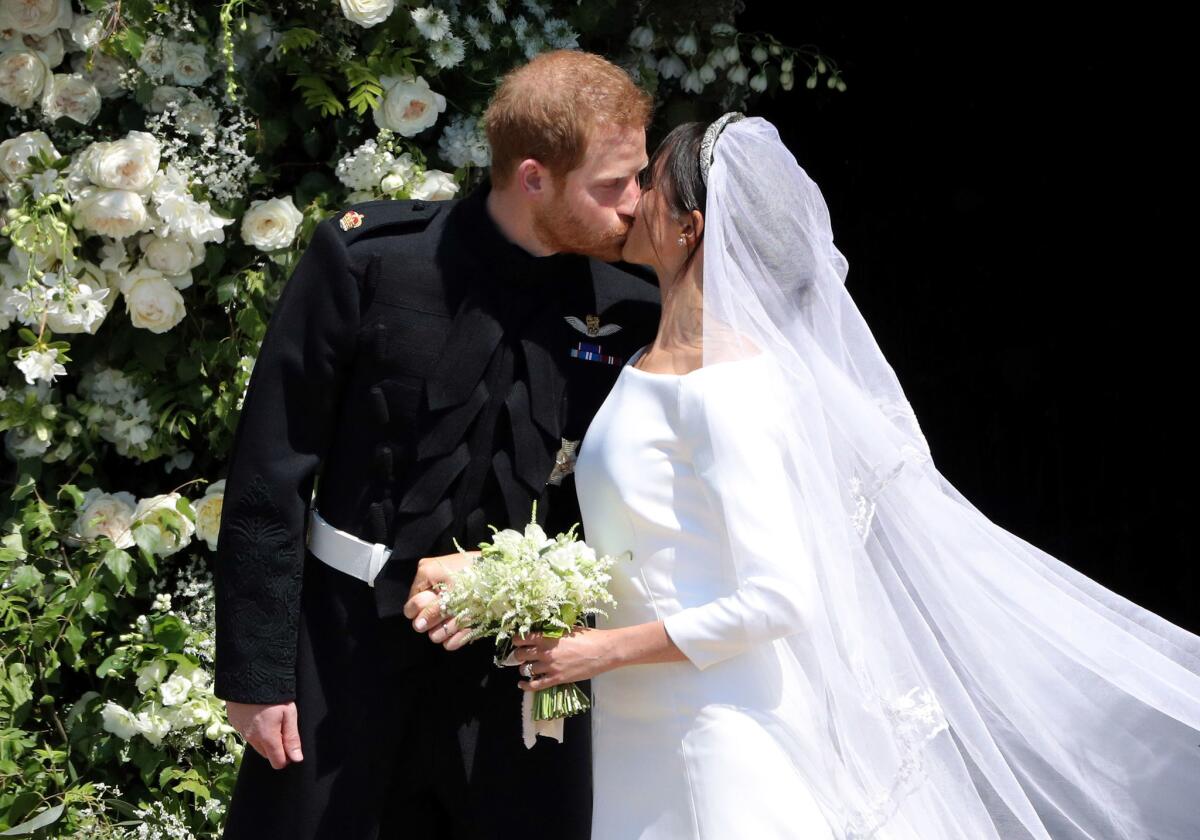 Meghan Markle and Prince Harry kissing at their wedding