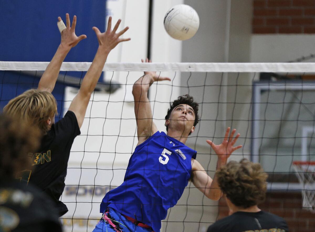 Fountain Valley's Alec Pinedjian (5) finds an opening for a kill during a Wave League boys' volleyball match on Friday.