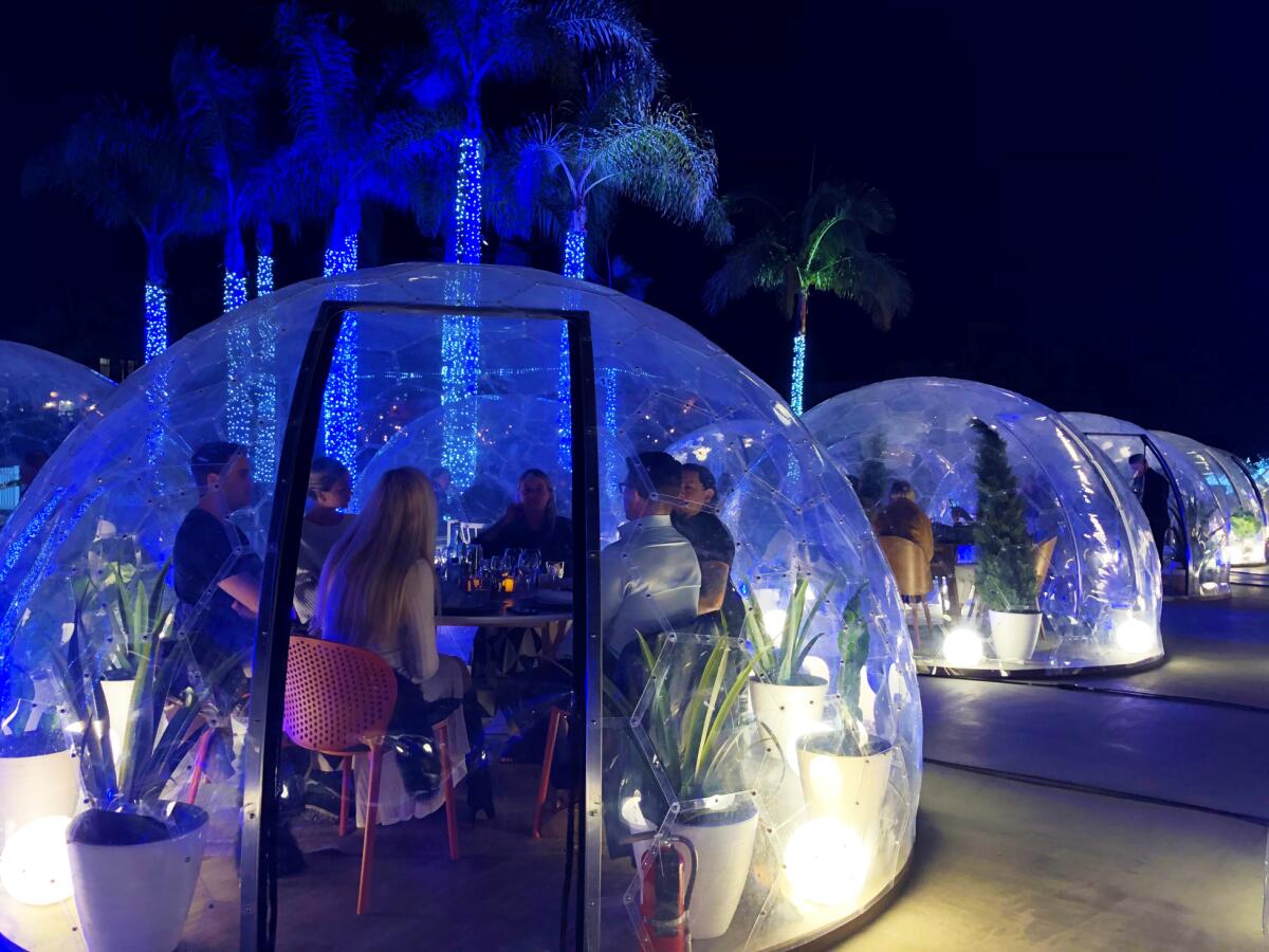 Up to six diners can be seated at tables inside 36 plastic domes for the Dinner With a View event at Liberty Station through March 8.