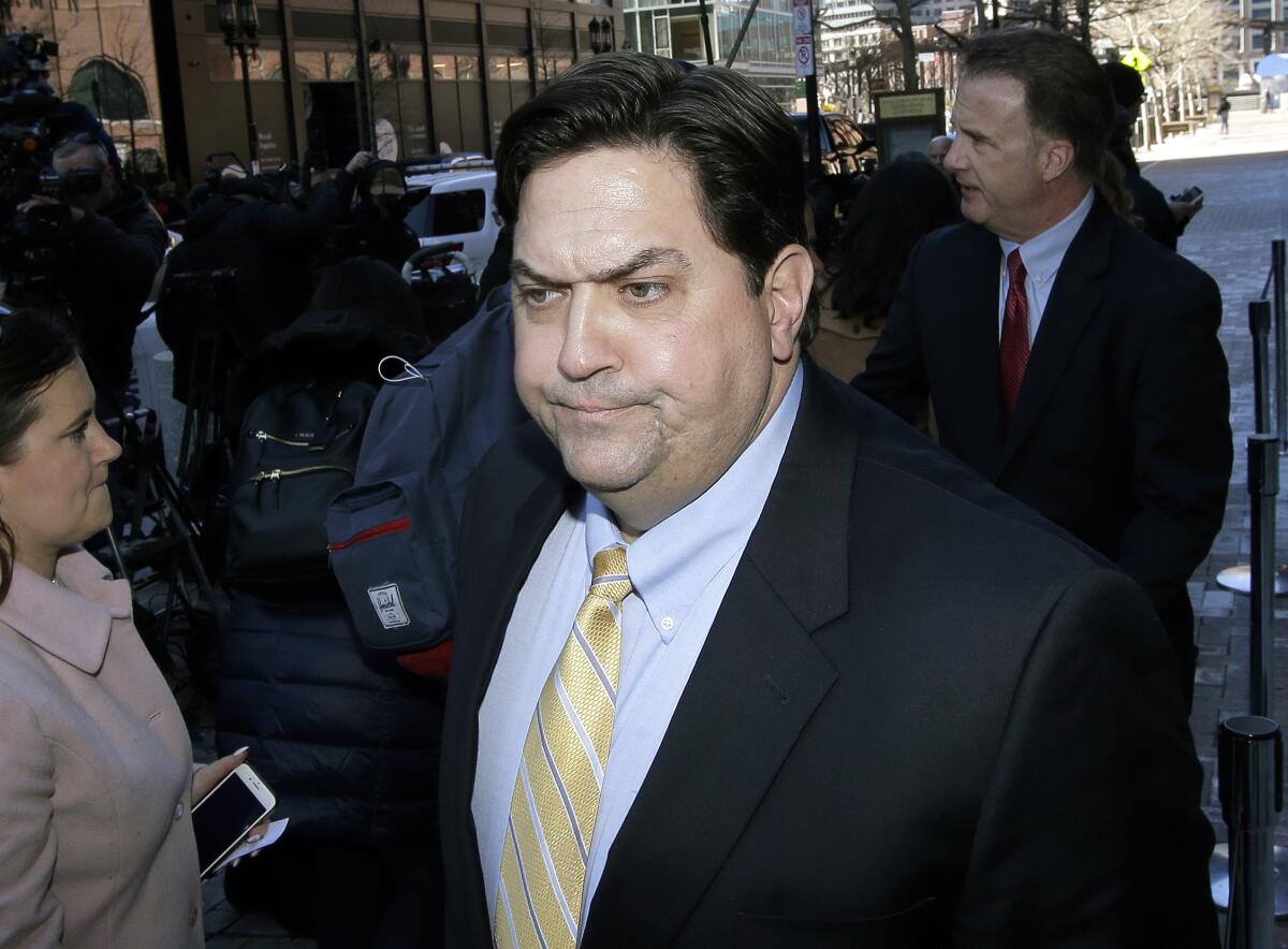 FILE— In this March 25, 2019 file photo, William Ferguson, former Wake Forest volleyball coach, arrives at federal court in Boston, to face charges in a nationwide college admissions bribery scandal. Federal prosecutors have promised to drop their case against Ferguson if he pays a $50,000 fine and follows certain conditions, according to court documents unsealed Tuesday, Oct. 12, 2021. (AP Photo/Steven Senne, File)
