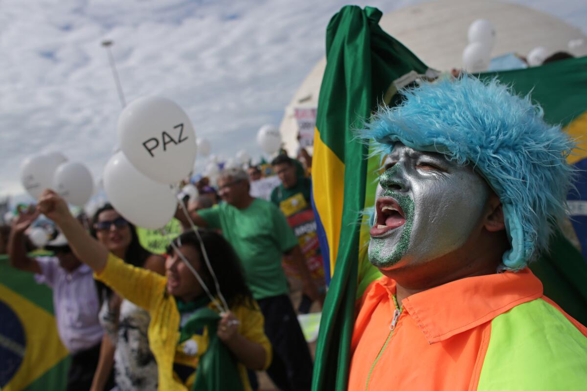 Demonstrators demand the impeachment of President Dilma Rousseff in Brasilia, Brazil, on Sunday.