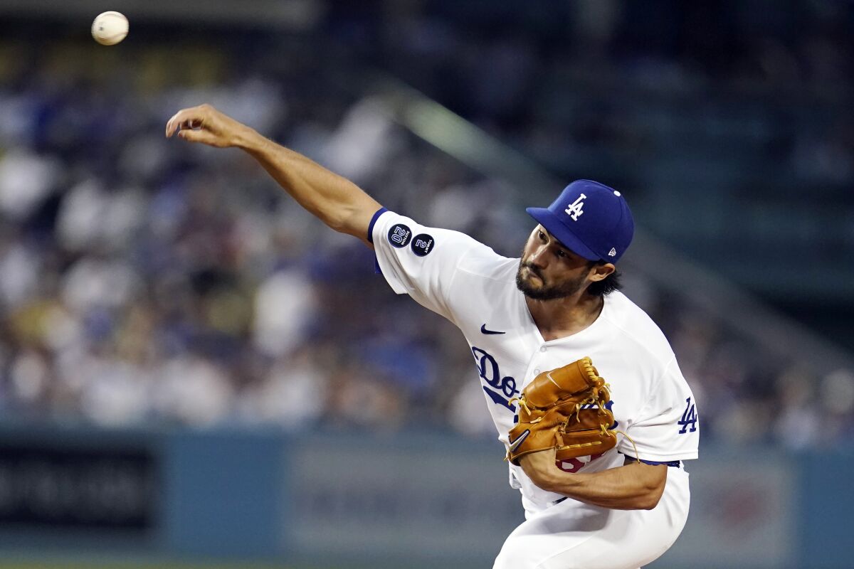 Dodgers relief pitcher Mitch White throws to a Pittsburgh Pirates batter.