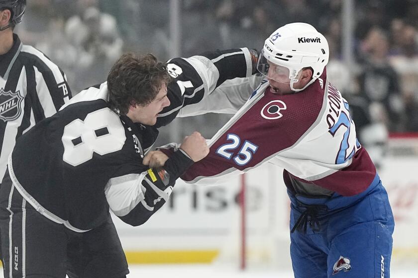 Los Angeles Kings right wing Alex Laferriere, left, and Colorado Avalanche right wing Logan O'Connor fight during the second period of an NHL hockey game Wednesday, Oct. 11, 2023, in Los Angeles. (AP Photo/Mark J. Terrill)