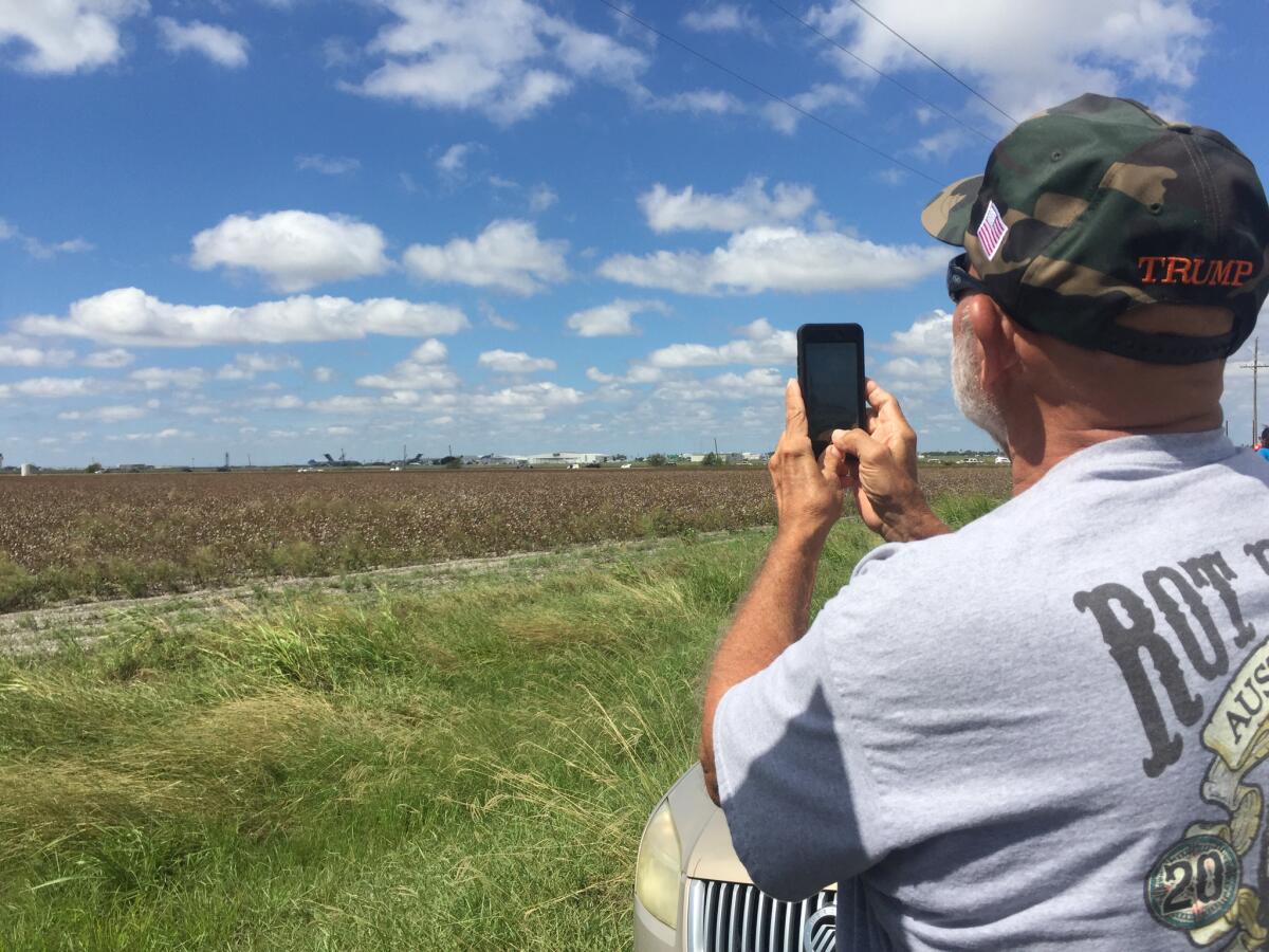 From along Highway 44, Phillip Gonzalez of Corpus Christi, Texas, photographs Air Force One landing.