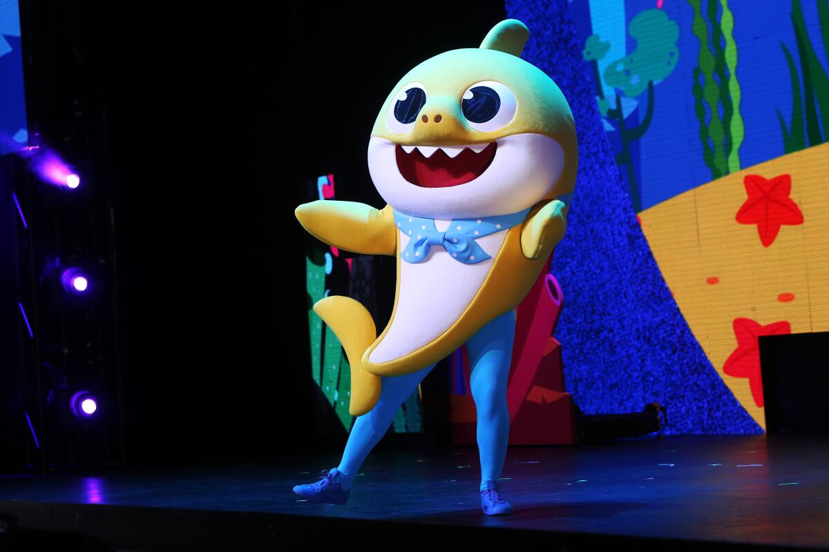 Baby Shark dances on stage during a Baby Shark Live! performance in October at the Terrace Theater in Long Beach.