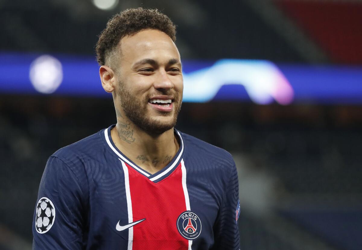 PSG's Neymar smiles during the Champions League 