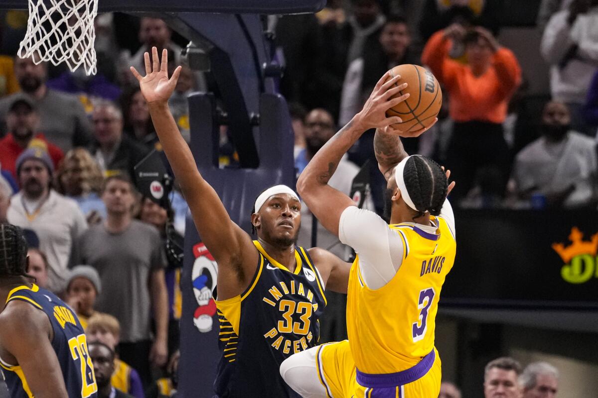 Lakers forward Anthony Davis shoots over Indiana Pacers center Myles Turner.