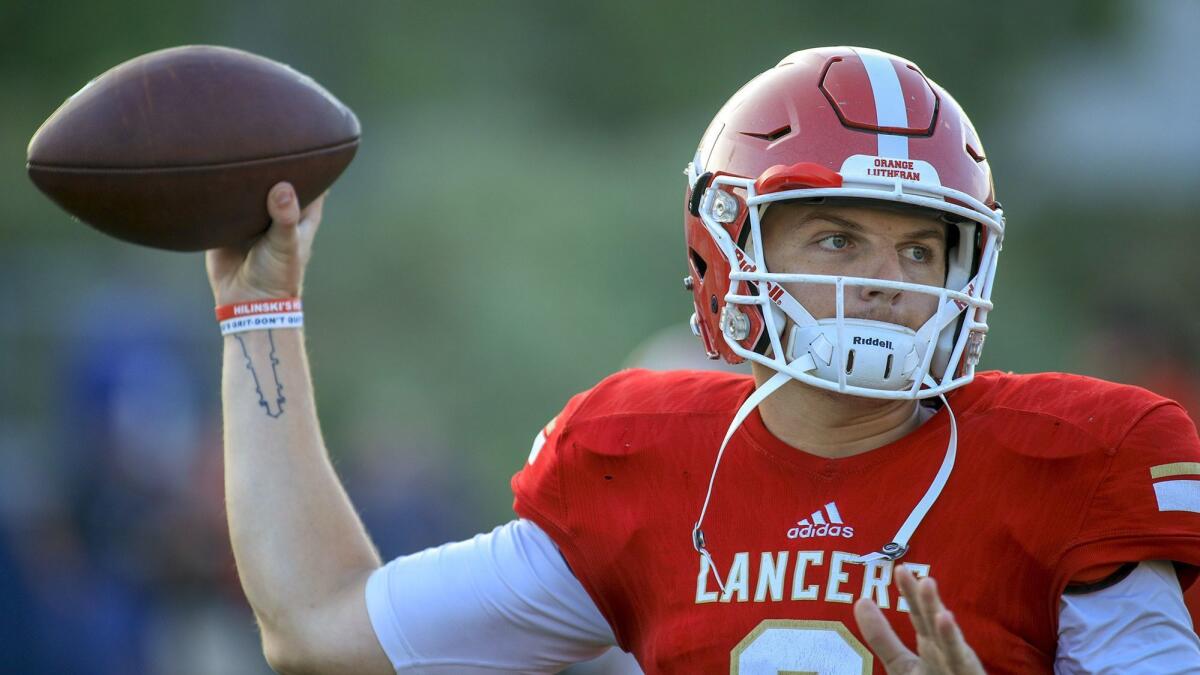 Ryan Hilinski warms up before a game with Orange Lutheran in August 2018.